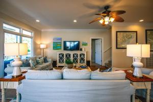 a living room with a couch and a tv at I'll Have Another in Edisto Island