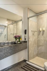 a bathroom with a shower with a glass door at Blue Tree Premium Paulista in São Paulo