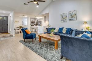 a living room with blue couches and a table at Families Welcome! Recently Renovated Home in Katy in Katy