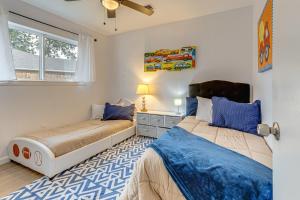 a bedroom with two beds and a window at Families Welcome! Recently Renovated Home in Katy in Katy
