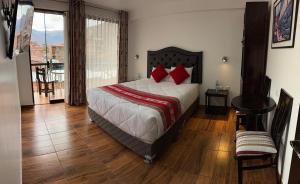 Postel nebo postele na pokoji v ubytování Hotel Quilla