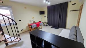 a living room with a table and a couch at Apartment Kompara in Ajdovščina