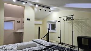 a bedroom with a bed and a mirror at Apartment Kompara in Ajdovščina