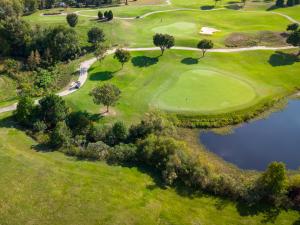 an overhead view of a golf course with a pond at Avoca Room at The Inn, Occano Arnold Palmer Golf Course  +19 photos