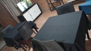 an overhead view of a dining table and chairs at Pousada Solar Curitiba in Curitiba