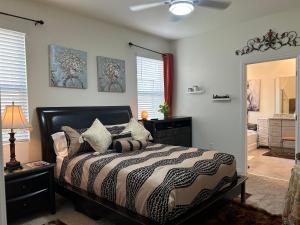 a bedroom with a bed and a dresser and a mirror at Rooms SWEET Rooms in Davenport +76 photos