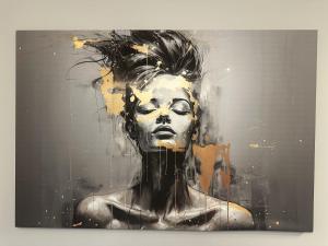 a painting of a woman with at CityLine Apartment Nova Ochota in Warsaw