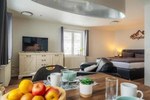 a living room with a table with fruit on it at Fünf Harzer Berge Oderberg in Sankt Andreasberg