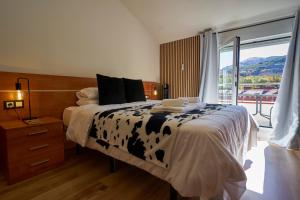 Ένα ή περισσότερα κρεβάτια σε δωμάτιο στο Bicis & Vacas +48 φωτογραφίες