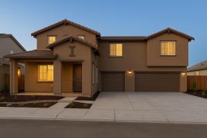 a house with a garage in front of it at Modern Private Room with Private Bath in Manteca