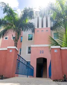 a building with a palm tree in front of it at Marbella | PH Rooftop Oasis in Costa Brava, Ceiba in Santa Maria