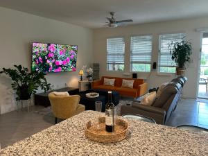 a living room with a couch and a table at Rooms SWEET Rooms in Davenport