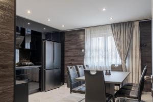 a kitchen and dining room with a table and chairs at Luxury Apartment Schwabach 2 in Schwabach