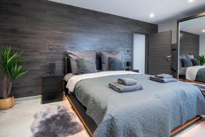 a bedroom with a large bed with towels on it at Luxury Apartment Schwabach 2 in Schwabach