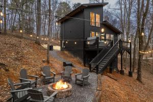 a cabin with a fire pit in front of it at Hot Tub, Games, Fireplace & Fast WiFi Near Dollywood in Sevierville