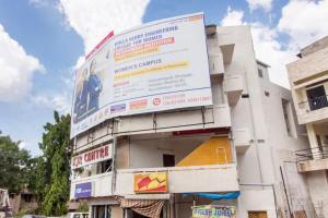 a building with a large sign on the side of it at Hotel O Shannu Residency in Secunderabad +16 photos