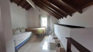 a living room with a couch and a table at Casa 05 - Grande Família in Angra dos Reis +15 photos