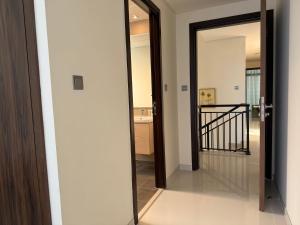 a glass door leading to a hallway in a house at Spacious Fully Furnished 6BR Villa in Damac Hill2 in ‘Ūd al Bayḑāʼ +96 photos