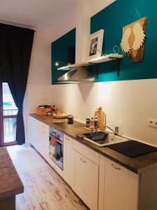a kitchen with a sink and a counter top at Petite Charlotte in Tarnów