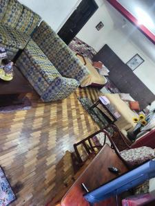 an overhead view of a living room with a couch at Minidepartamento central en Ambato, para 1 a 8 personas en 3 Camas y un colchon in Ambato