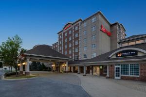 a hotel with a sign on the front of it at Chicago Marriott Midway in Bedford Park