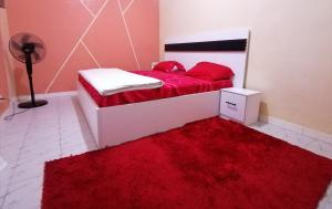 Ένα ή περισσότερα κρεβάτια σε δωμάτιο στο Résidence hibis chez M&B