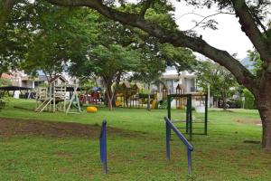 a park with a playground with a tree at LAGOS DEL PEÑON 180 metros in Girardot