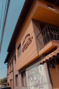 a building with a sign on the side of it at Къща за гости Орешака in Oreshak