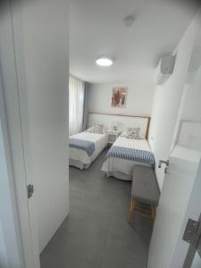 Postel nebo postele na pokoji v ubytování IPA Palm Garden + 9 fotografií