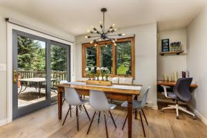 a dining room with a table and chairs at Meadow Ranch 384 Private Outdoor Hot Tub in Snowmass Village