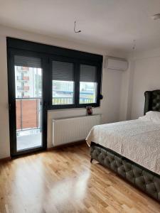 Ένα ή περισσότερα κρεβάτια σε δωμάτιο στο Jagodina CRNJANSKI