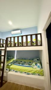 a bunk bed in a room with a bunk bedscribed at Le Mirage GT in Taxisco +39 photos