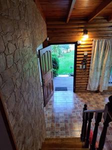 an open door to a house with a stone wall at Quinta El Zorzal in La Unión
