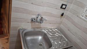 a sink in a bathroom with a facet at Horus key Nile View in Aswan