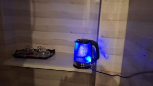 a blue coffee cup sitting on a shelf at Horus key Nile View in Aswan