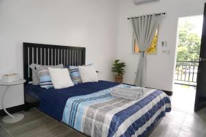 Postel nebo postele na pokoji v ubytování Villa Trajano Resort