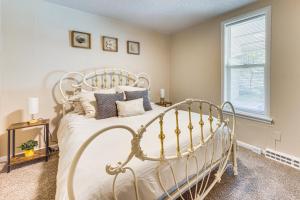 a bedroom with a white bed and a window at Pueblo Perfection A Quiet Colorado Adventure! in Pueblo