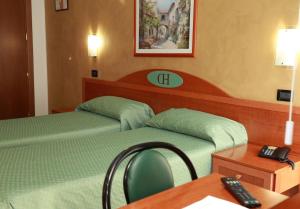 Postel nebo postele na pokoji v ubytování HD Hotel