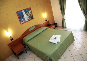 Postel nebo postele na pokoji v ubytování HD Hotel + 5 fotografií