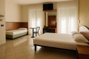 Postel nebo postele na pokoji v ubytování HD Hotel