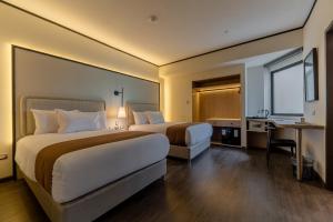 Giường trong phòng chung tại Hotel Límade +45 ảnh