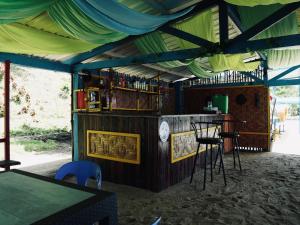 a bar in a tent with chairs and a table at Jlb resort and tours,Guest House in Valdez
