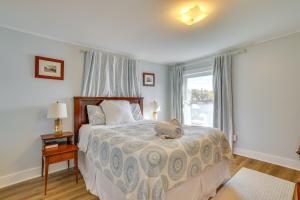 a bedroom with a bed with a stuffed animal on it at All-Season Getaway on Lake Winola Dock and Sunroom! in Factoryville