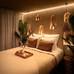 Ένα ή περισσότερα κρεβάτια σε δωμάτιο στο Cenote Suite - Expérience sensorielle