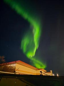 an image of the northern lights in the sky at Ary & Pablo Airport Stay in Keflavík