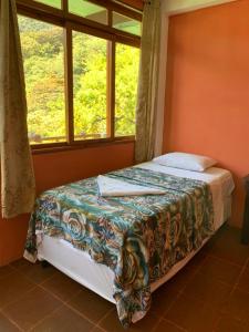 Postel nebo postele na pokoji v ubytování Hostal Xeabaj La Cascada