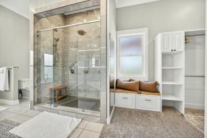 a bathroom with a shower with a glass door at Meadowsweet Farm- Sleeps 18, Outdoor Kitchen in Talent +74 photos