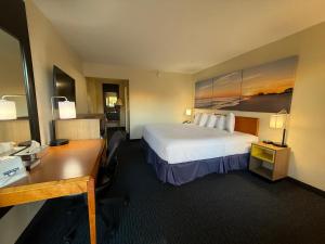 Postel nebo postele na pokoji v ubytování Gateway Inn