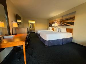 Postel nebo postele na pokoji v ubytování Gateway Inn