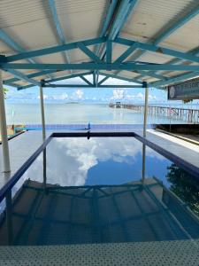 a pool of water with a view of the ocean at Jlb resort and tours,Guest House in Valdez